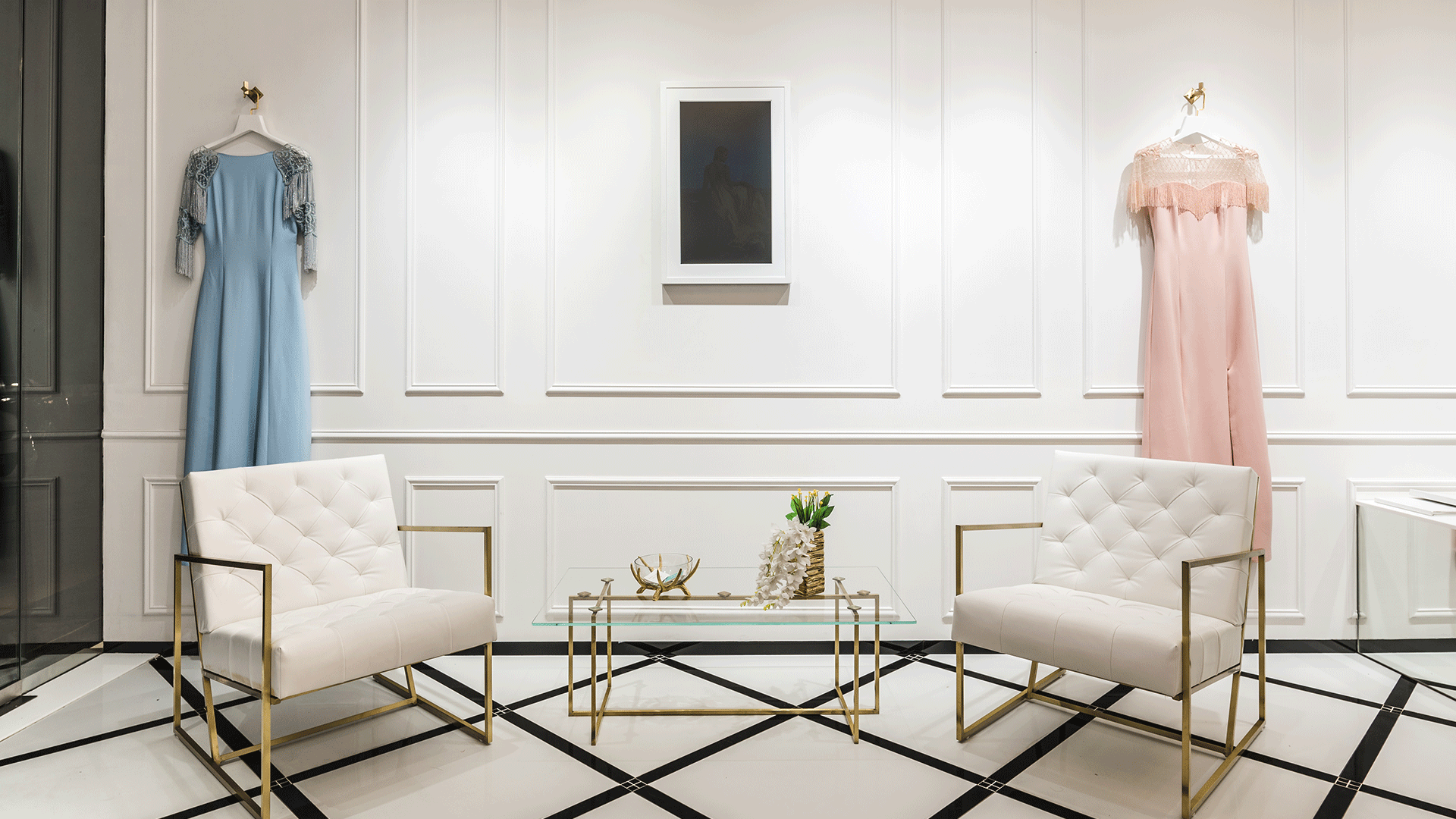 A white canvas with bold gold-and-black accents create a classy retail experience
