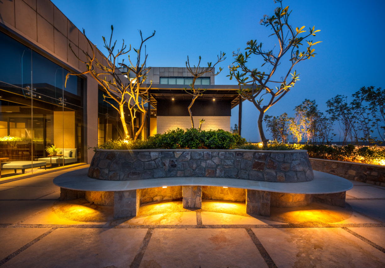 An opulent rooftop office with biophilic design interventions